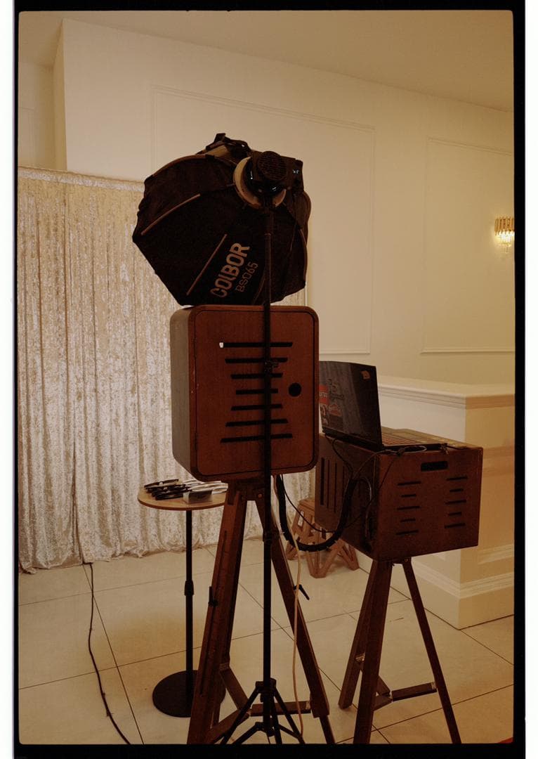 The wooden photobooth camera and backdrop at a venue